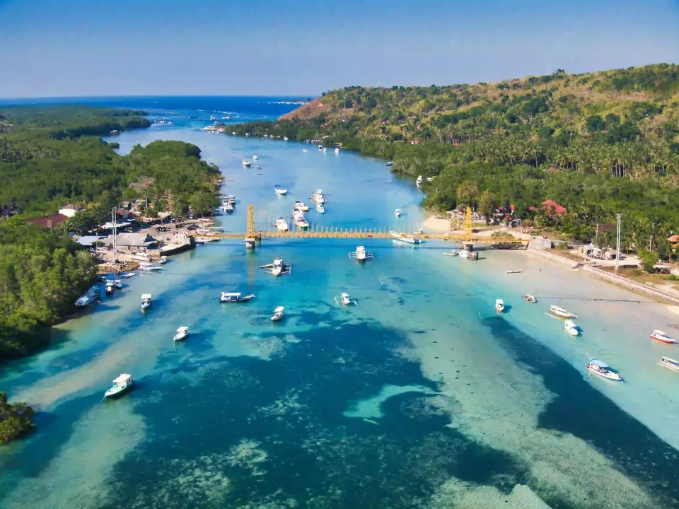 Aerial view of Nusa Lembongan and Nusa Ceningan with boats moored in the channel