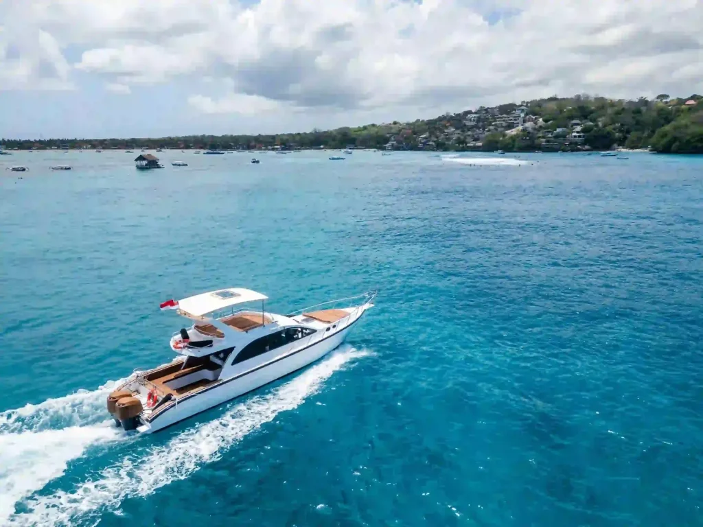 A motor yacht cruising the Lembongan coast